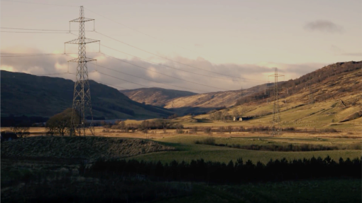 Scenic countryside with pylons running throughout.