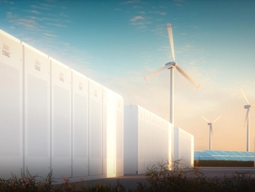 Data centre being powered by wind turbines in the background of the shot.